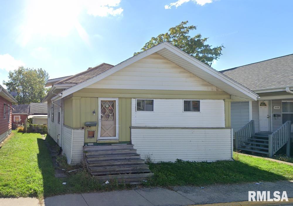 1116 18th Ave, Rock Island, IL 61201 - bungalow-style home with board and batten siding, roof with shingles, a front lawn, and entry steps