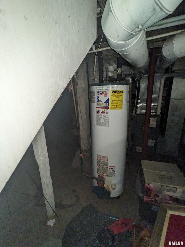 utility room featuring water heater