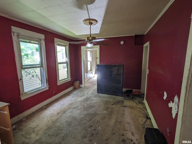 unfurnished dining area featuring ornamental molding and ceiling fan