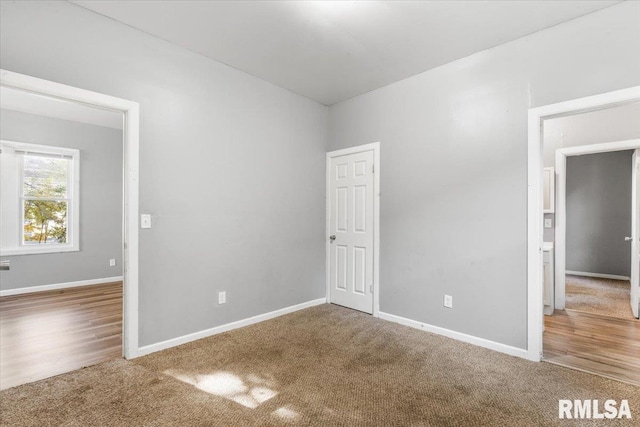 empty room with hardwood / wood-style flooring