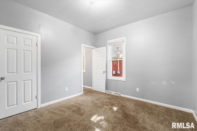 unfurnished bedroom featuring carpet