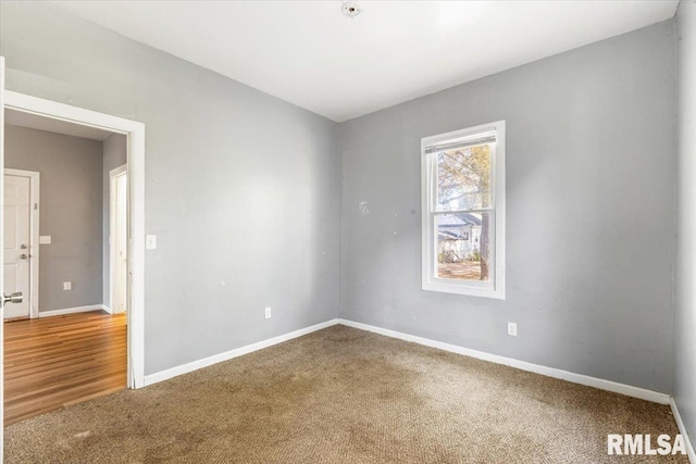 spare room with hardwood / wood-style floors