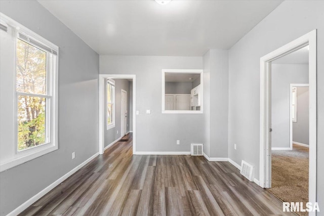 empty room featuring dark hardwood / wood-style floors