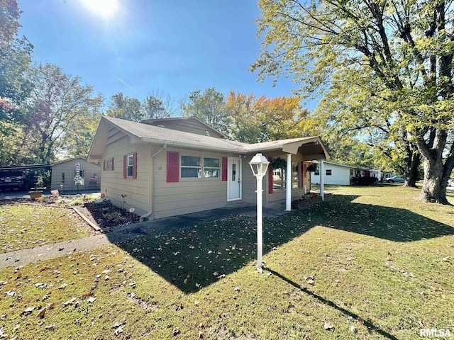 bungalow-style home with a front yard