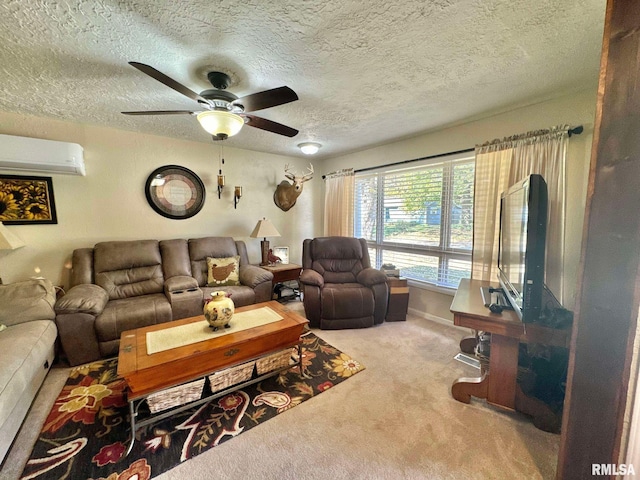 living room featuring carpet, a wall unit AC, a textured ceiling, and ceiling fan