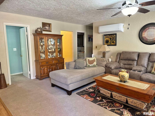 living room with a wall mounted air conditioner, a textured ceiling, carpet, and ceiling fan