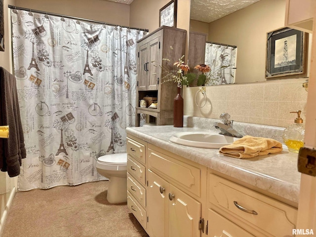 bathroom featuring curtained shower, backsplash, a textured ceiling, toilet, and vanity