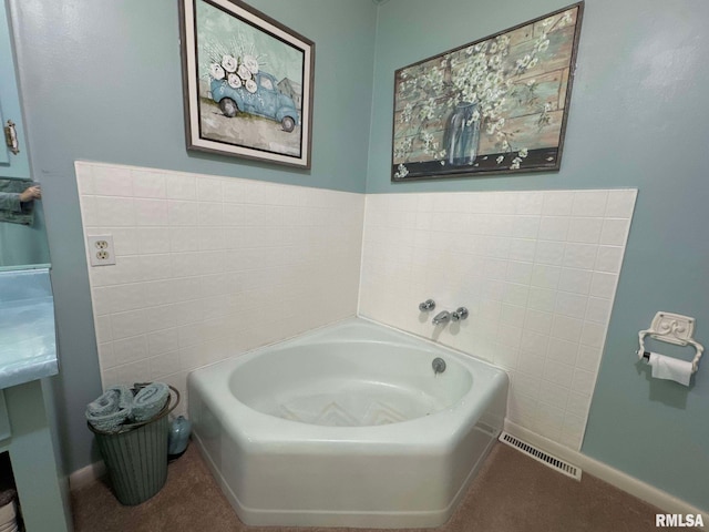 bathroom featuring a tub to relax in