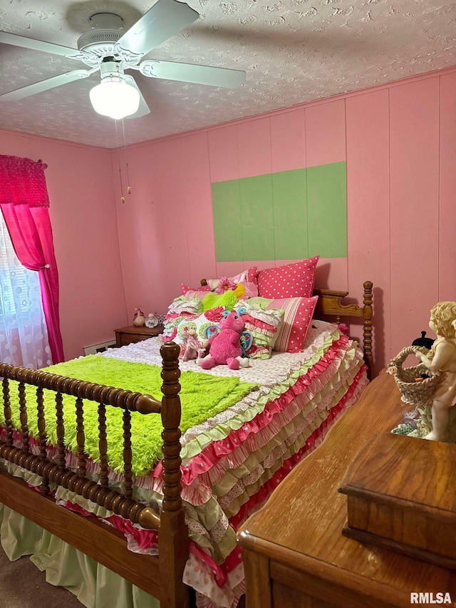 bedroom featuring ceiling fan and a textured ceiling