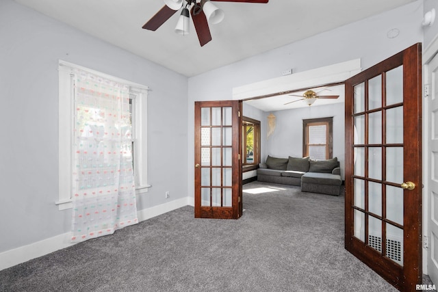 interior space featuring ceiling fan and carpet flooring