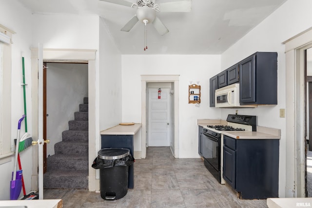 kitchen featuring ceiling fan and black range oven