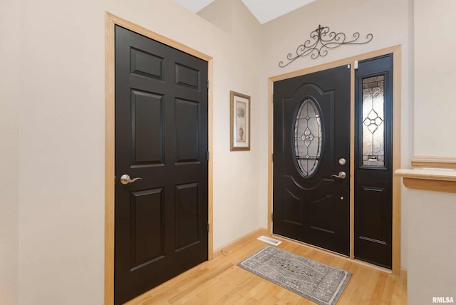 foyer entrance with light hardwood / wood-style floors