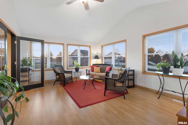 sunroom featuring ceiling fan and vaulted ceiling