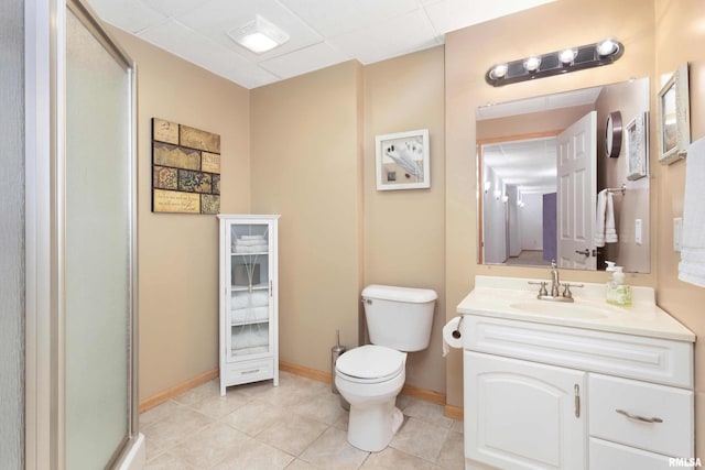 bathroom with walk in shower, vanity, toilet, and tile patterned flooring