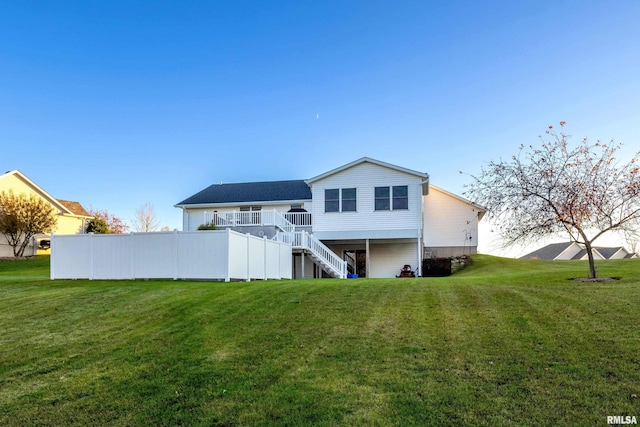 rear view of house with a yard