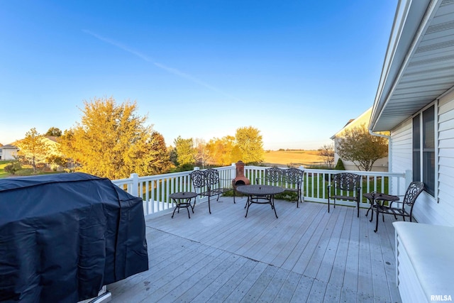 wooden deck with grilling area