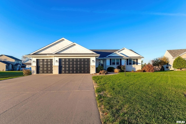 ranch-style home featuring a garage and a front lawn