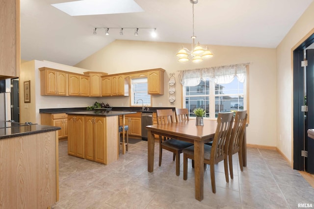 dining room featuring light tile patterned flooring, vaulted ceiling with skylight, and an inviting chandelier