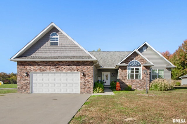 view of front of home featuring a front lawn and a garage