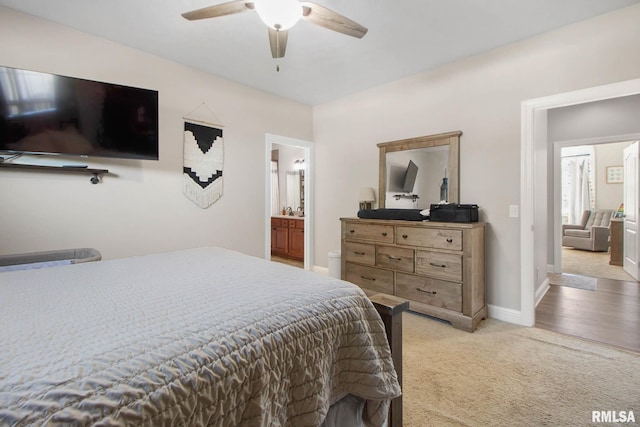 carpeted bedroom featuring connected bathroom and ceiling fan