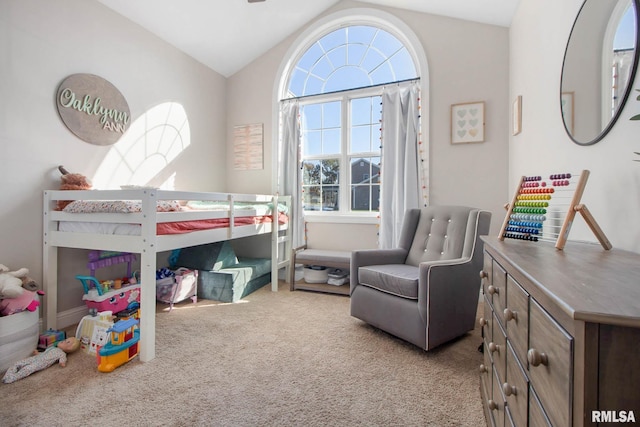 carpeted bedroom with lofted ceiling