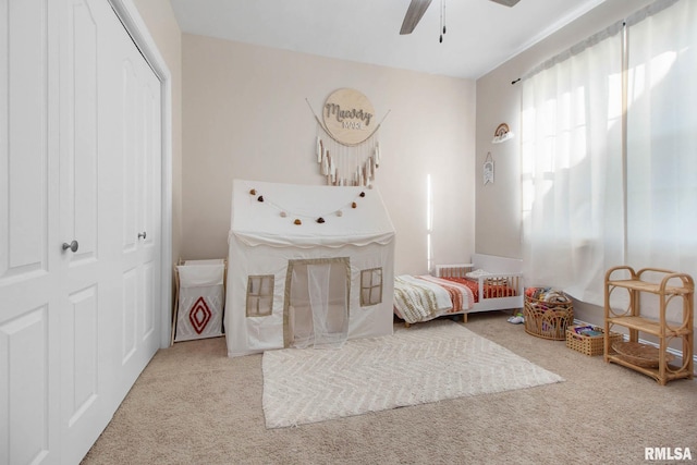 bedroom featuring a closet, carpet, and ceiling fan