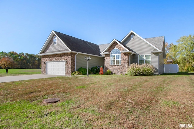 view of front of house featuring a front yard and a garage