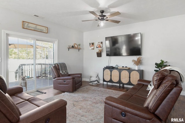 living room with ceiling fan and hardwood / wood-style floors