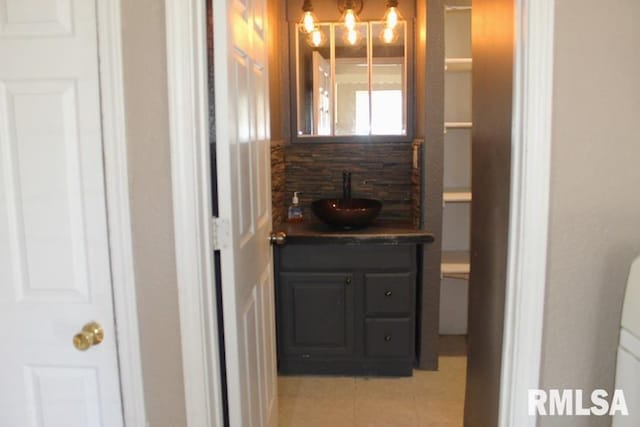 bathroom featuring tile patterned flooring and vanity