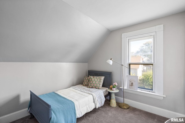 carpeted bedroom featuring vaulted ceiling