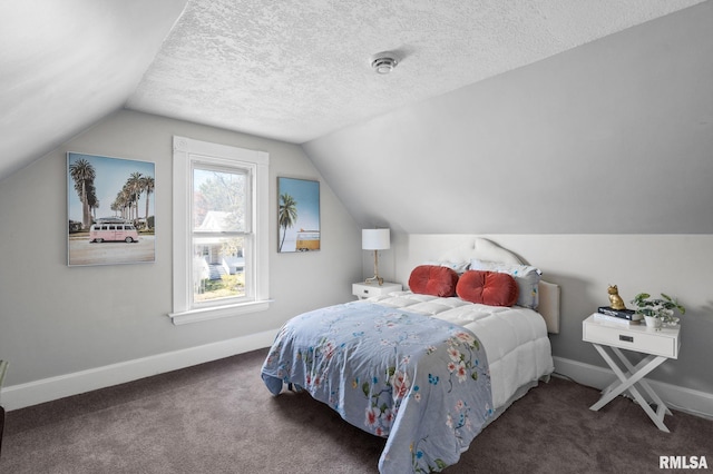 carpeted bedroom with lofted ceiling and a textured ceiling