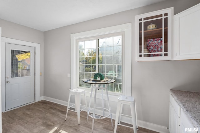 unfurnished dining area featuring light hardwood / wood-style floors