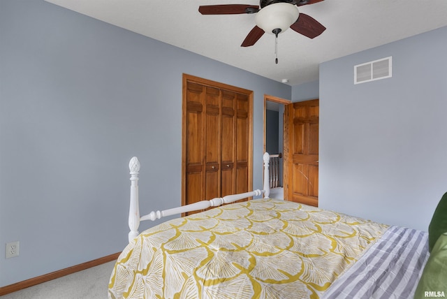 bedroom featuring ceiling fan, a closet, and carpet floors