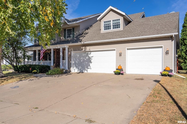 view of front of property with covered porch and a garage