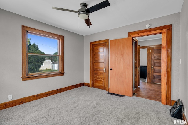 unfurnished bedroom with light carpet and ceiling fan