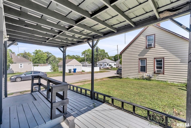 wooden terrace with cooling unit and a lawn