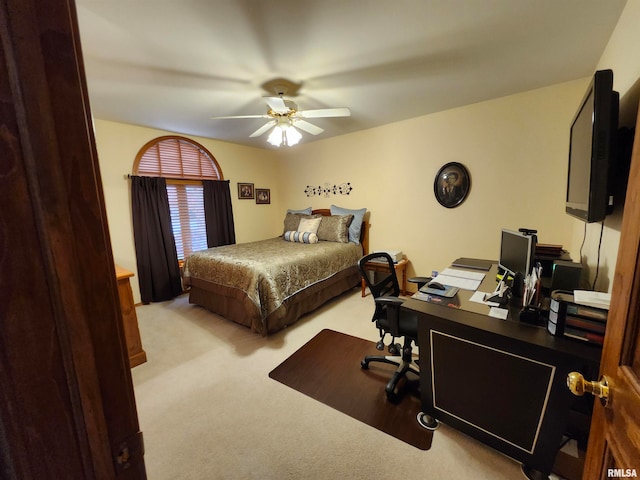 bedroom with light carpet and ceiling fan