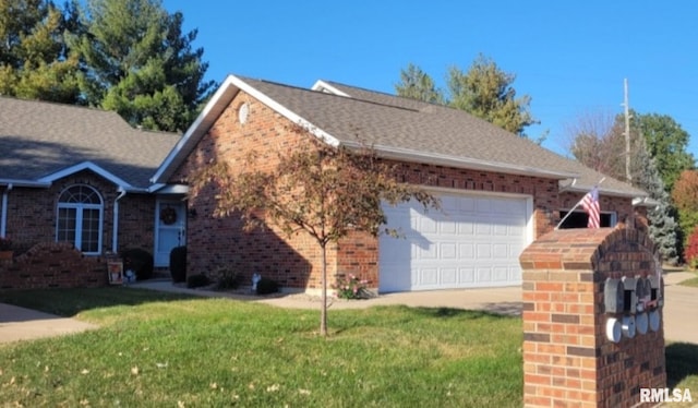 view of home's exterior with a garage and a lawn