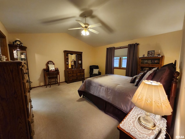 carpeted bedroom with lofted ceiling and ceiling fan