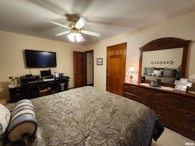 bedroom featuring light carpet and ceiling fan