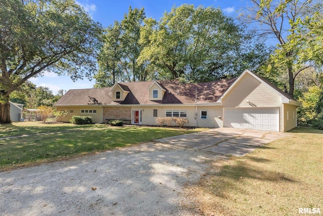 new england style home with a garage and a front yard