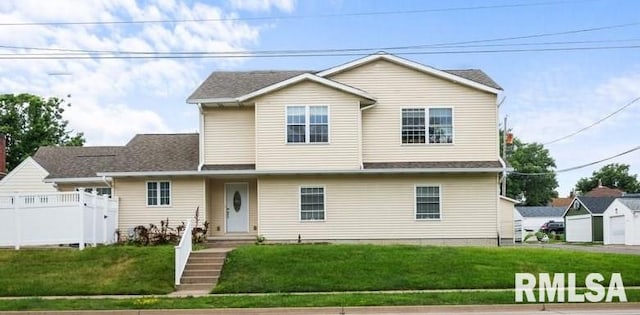 traditional-style home with a front yard