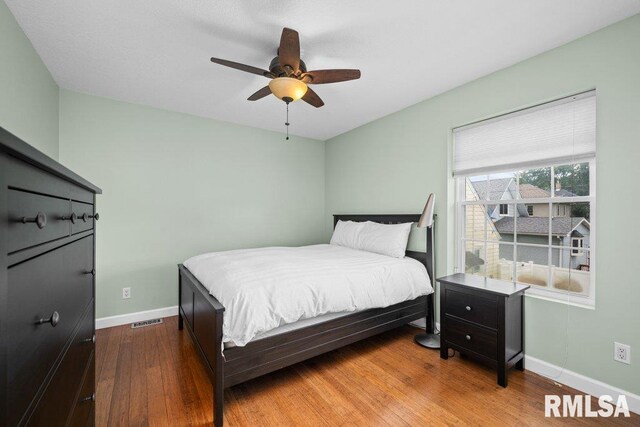 bedroom featuring hardwood / wood-style floors and ceiling fan