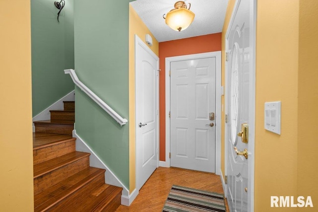 foyer with hardwood / wood-style floors