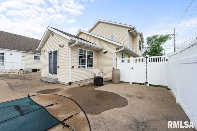 rear view of house with a patio