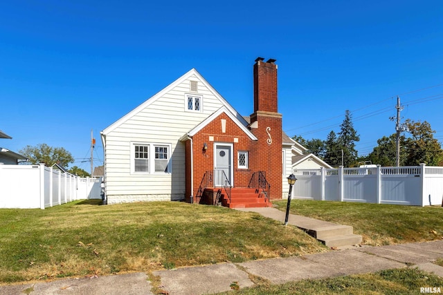 bungalow-style house featuring a front yard