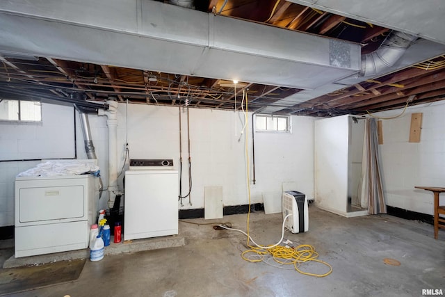 basement featuring washer and clothes dryer and plenty of natural light