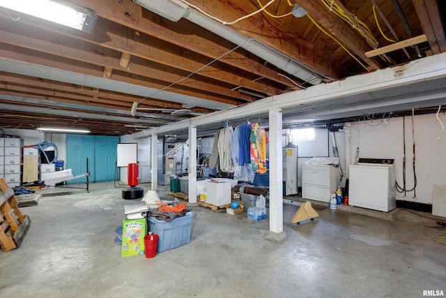 basement featuring water heater and washer and dryer