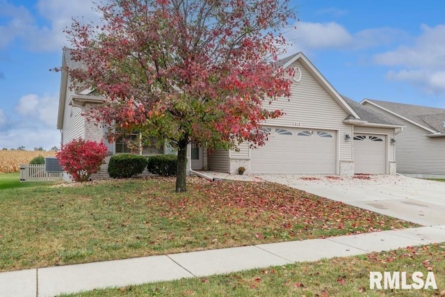 view of property hidden behind natural elements with a front yard and a garage