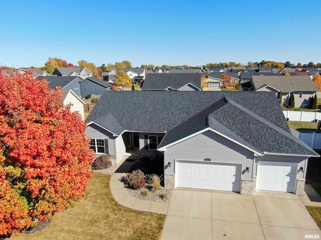 view of front of home featuring a front yard and a garage